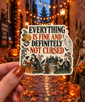Everything Is Fine and Definitely Not Cursed sticker, shown in use