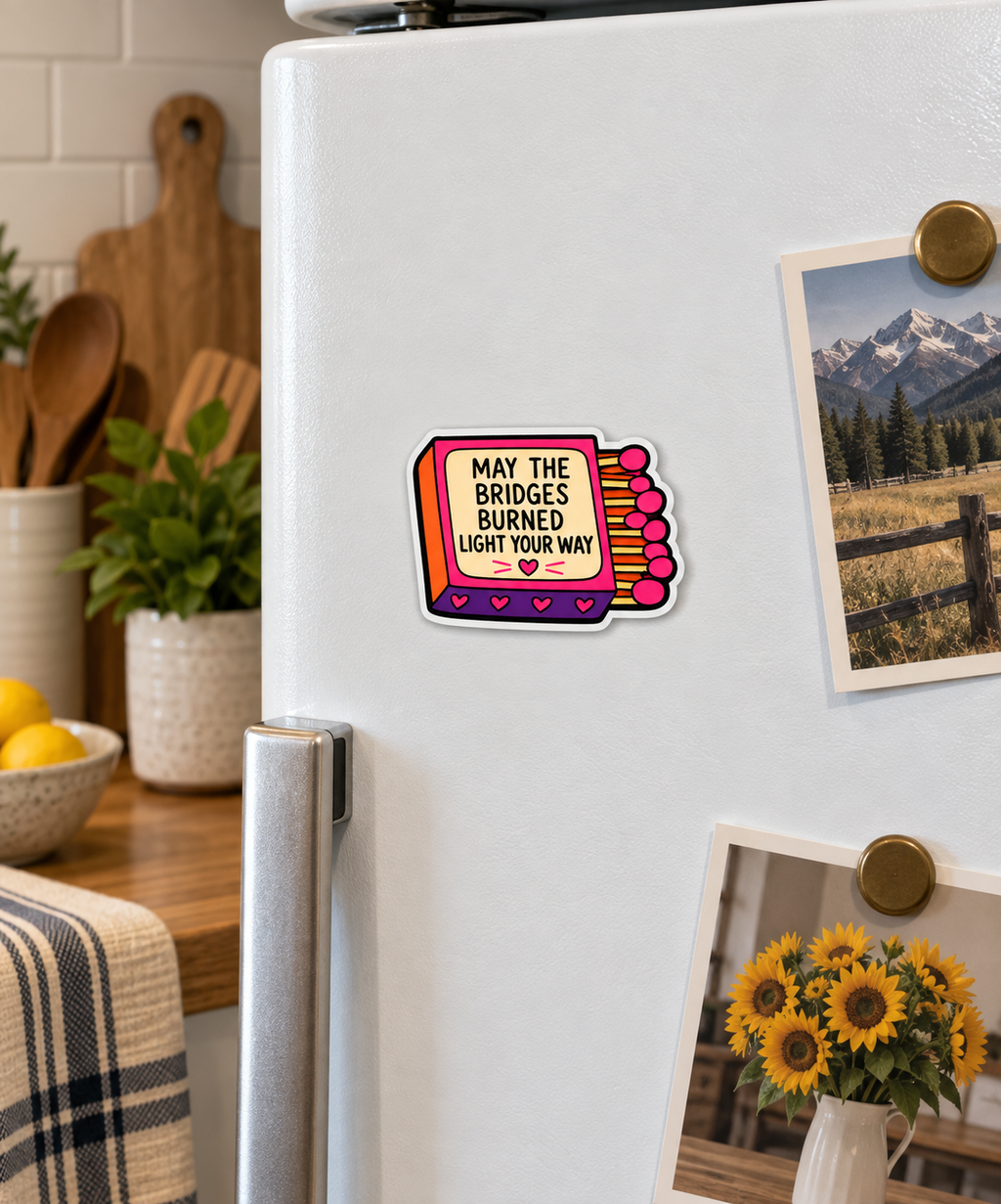 May the Bridges Burned Light Your Way magnet on a fridge